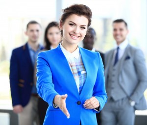 businesswoman with an open hand ready to seal a deal